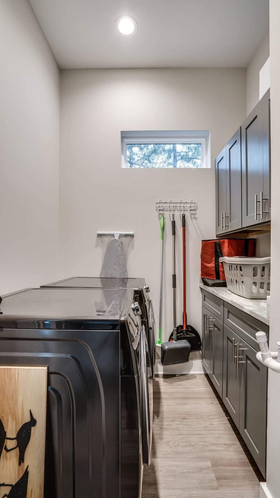 Laundry Room with Full-Sized Washer and Dryer