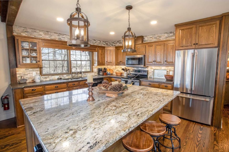Large Kitchen with Granite Countertops and Bartop Seating