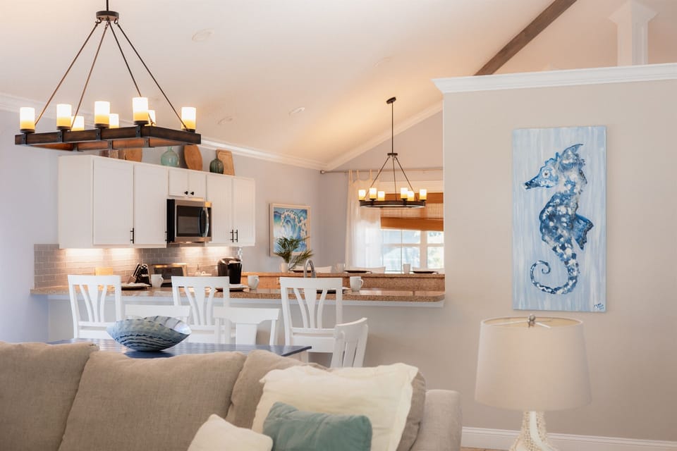 The open layout seamlessly connects the living room, dining area, and kitchen for effortless entertaining.