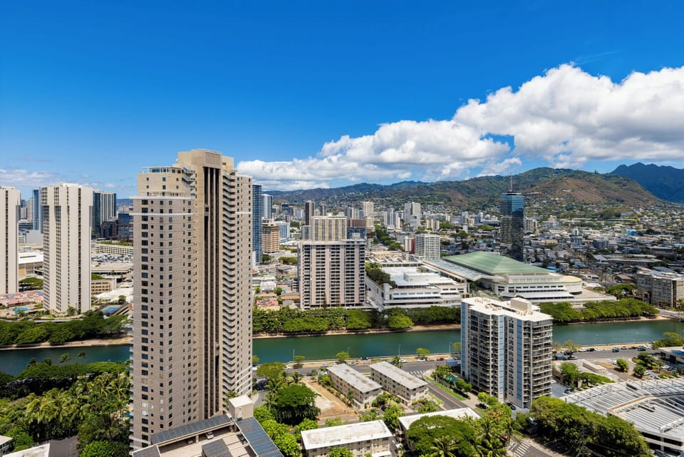 View - View from the unit from the living room area looking out over Ala Moana area and Koolau Mountains.