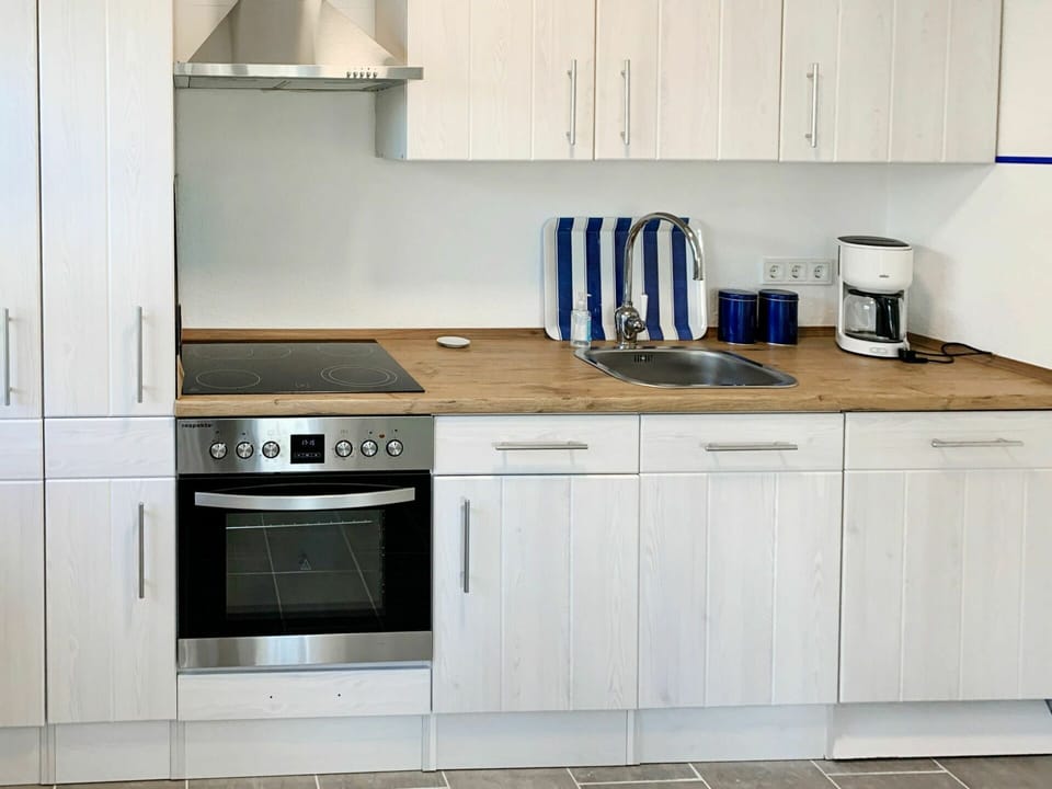 Cabinetry, Countertop, White, Kitchen Appliance, Kitchen Stove, Building, Kitchen, Kitchen Sink, Wood, Home Appliance