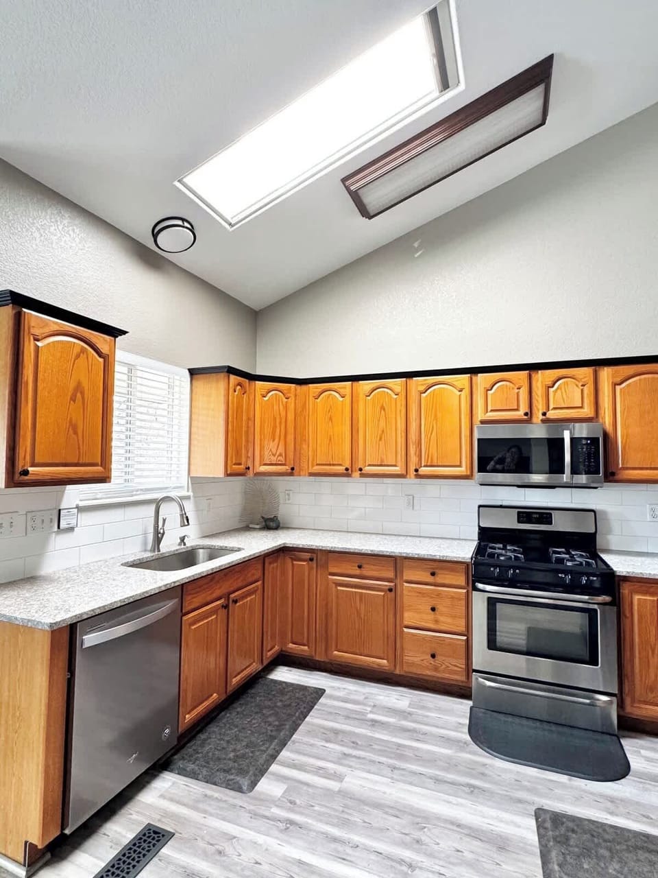 A kitchen full of natural sunlight with the skylight!