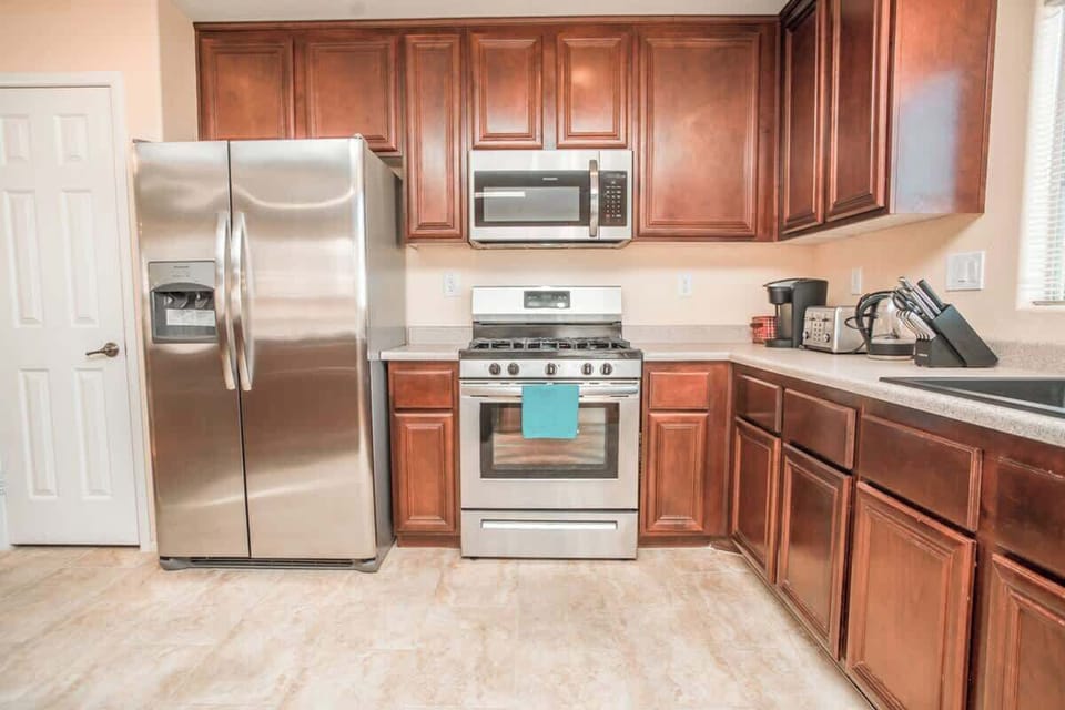 Beautiful stainless steel appliances and a fully stocked kitchen makes dining at home a breeze!