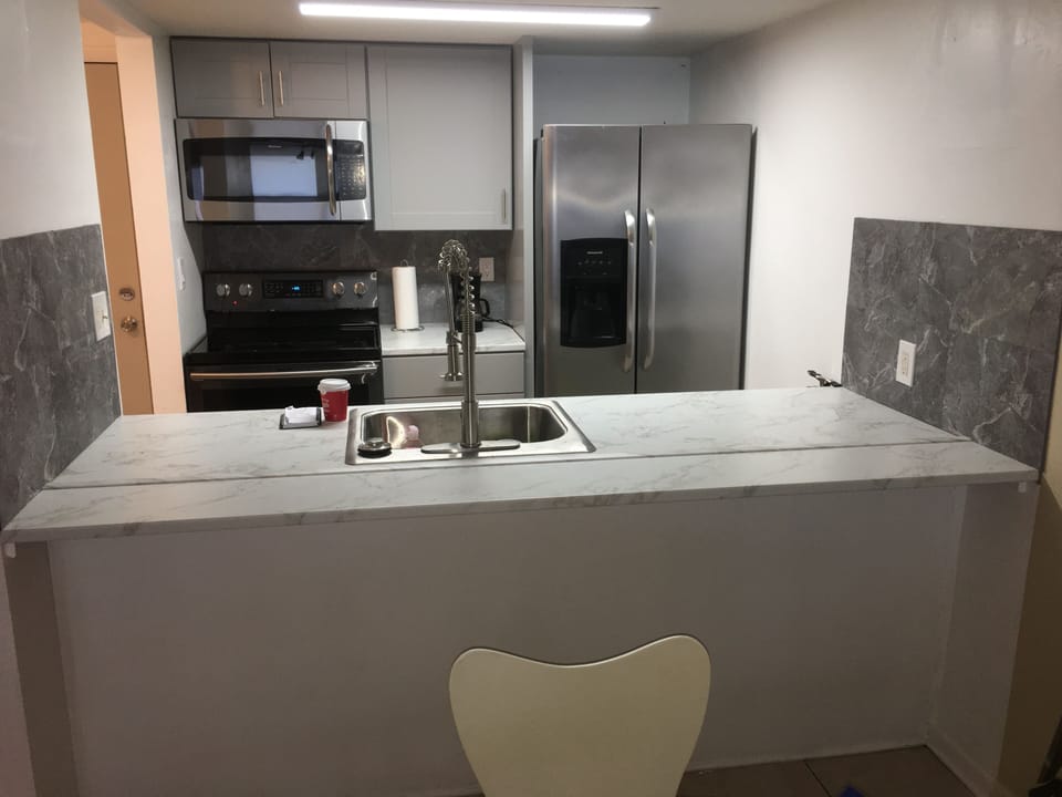 Kitchen counter.  Microwave.
