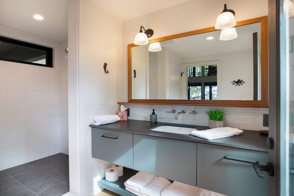 Sleek double vanity with a spacious countertop and soft lighting.