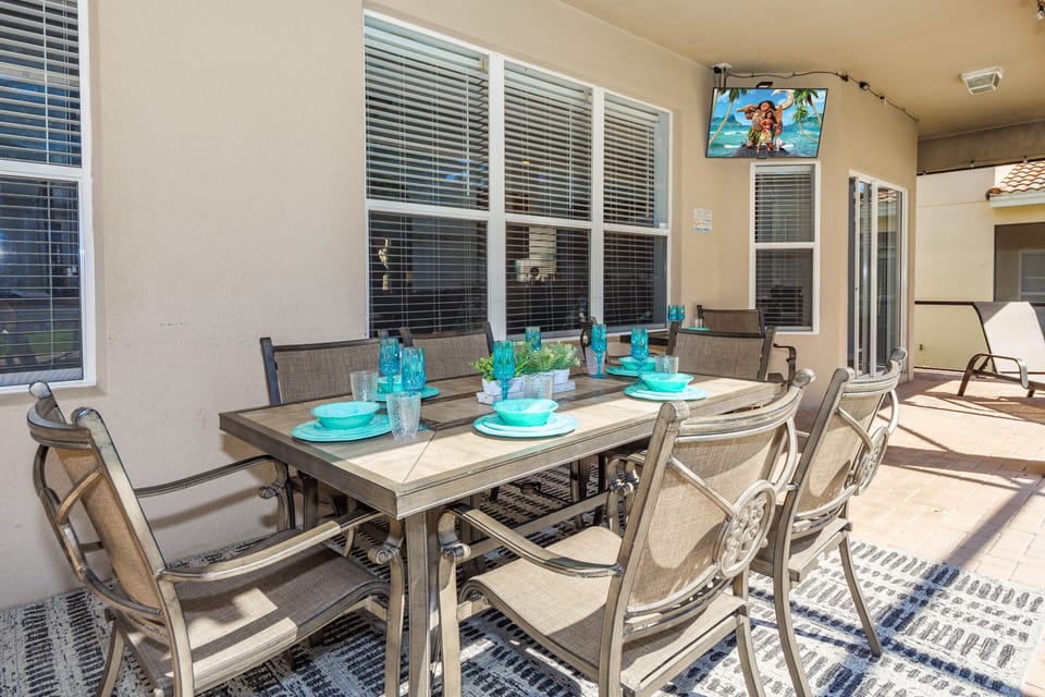 Covered Lanai with atmospheric string lighting and outdoor TV