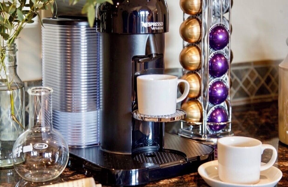 Nespresso machine with pods, for early morning coffee 