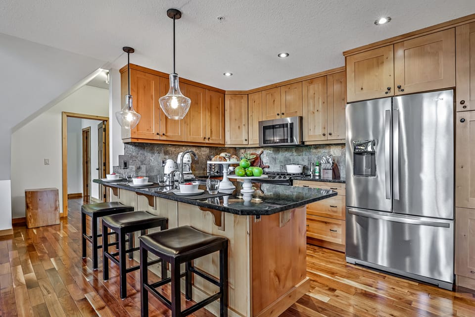 Fully equipped gourmet kitchen with high end appliances and stocked pantry.