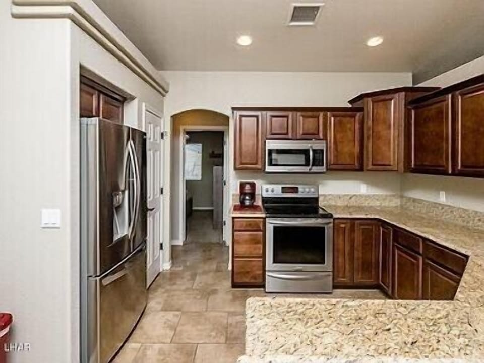 Kitchen — w/stainless steel appliances and granite countertops. 