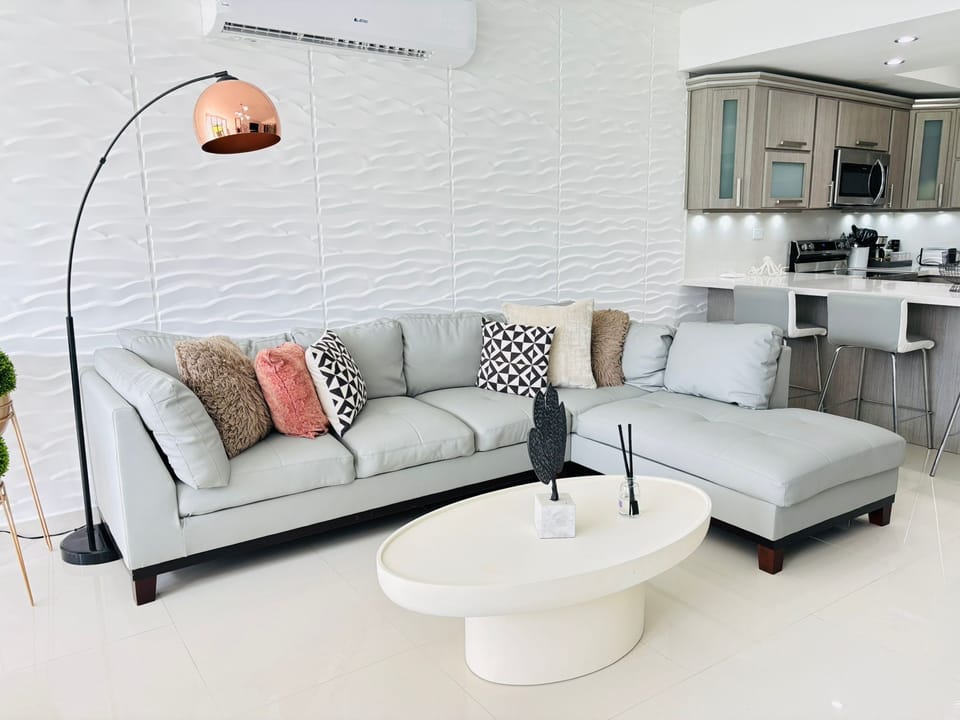 Open living room with lounge sofa and stylish coffee table