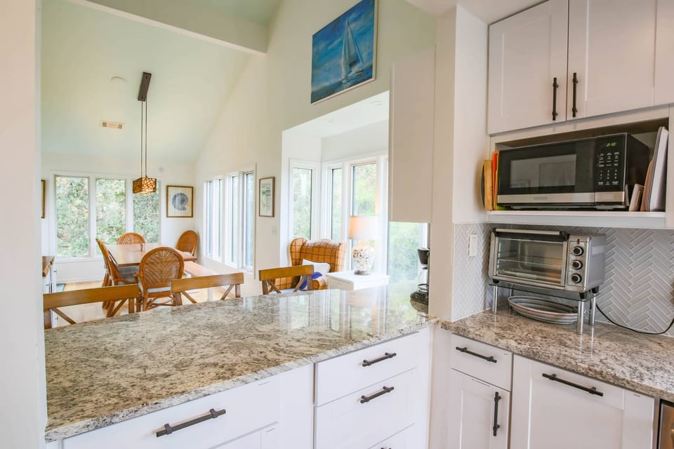 With its reverse floor plan, the Endless Summer kitchen, living room & dining area on the top floor receive terrific natural light.