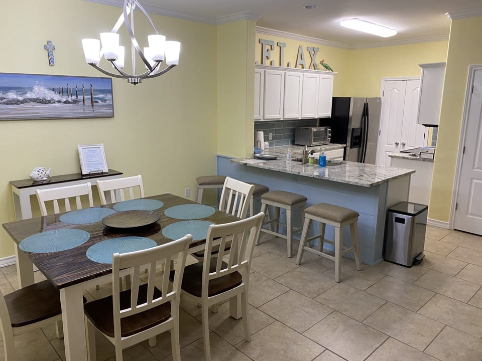 Great room - dining, breakfast bar, and kitchen