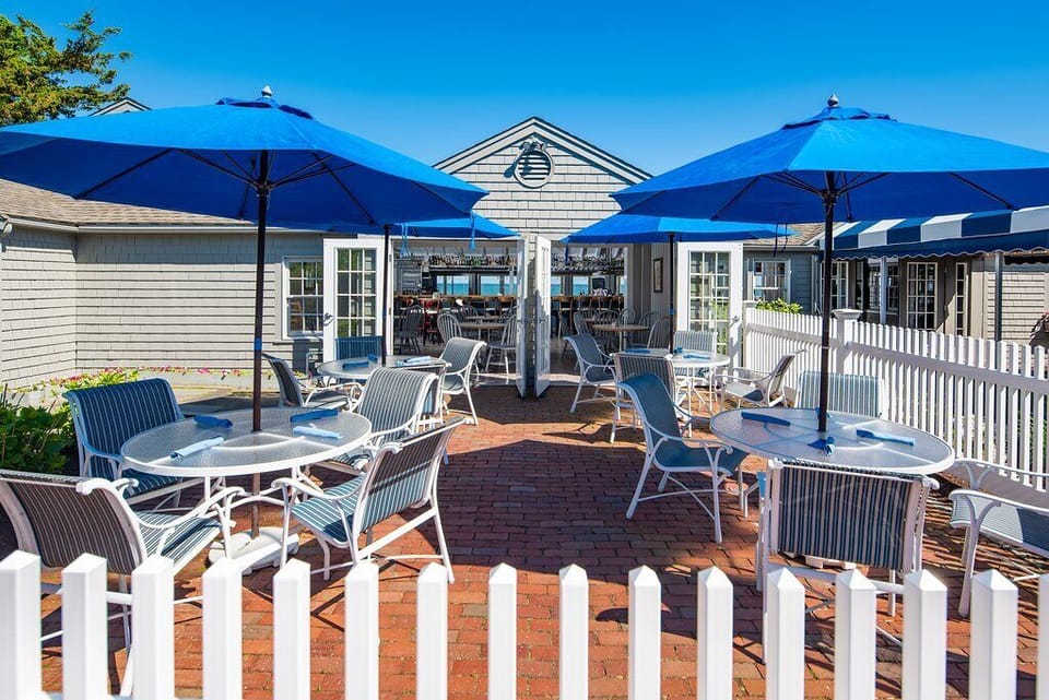 Popponesset Inn - Oceanfront dining room with patio out front for outdoor dining