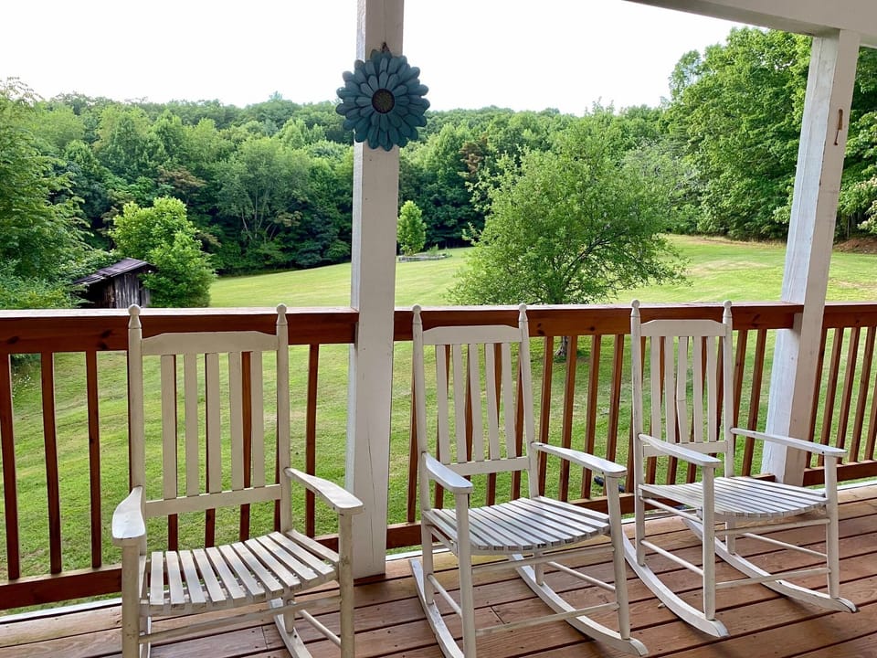 Expansive back porch overlooking 5 acres of rolling hills