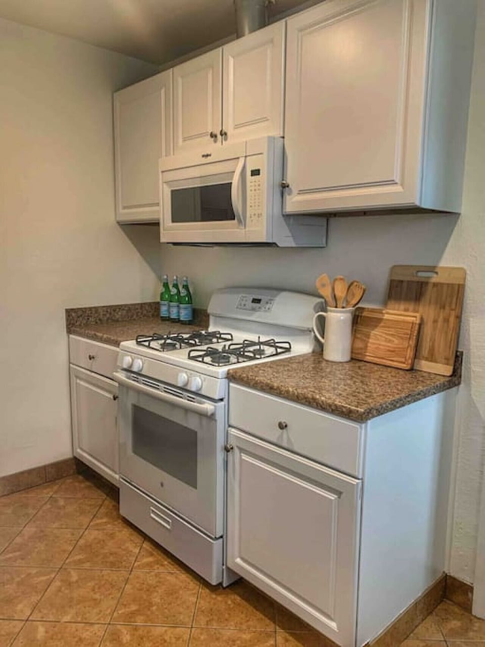 Unique kitchen space - plenty of counter space - refrigerator, microwave, oven, electric stove and all supplies needed for a home cooked meal.