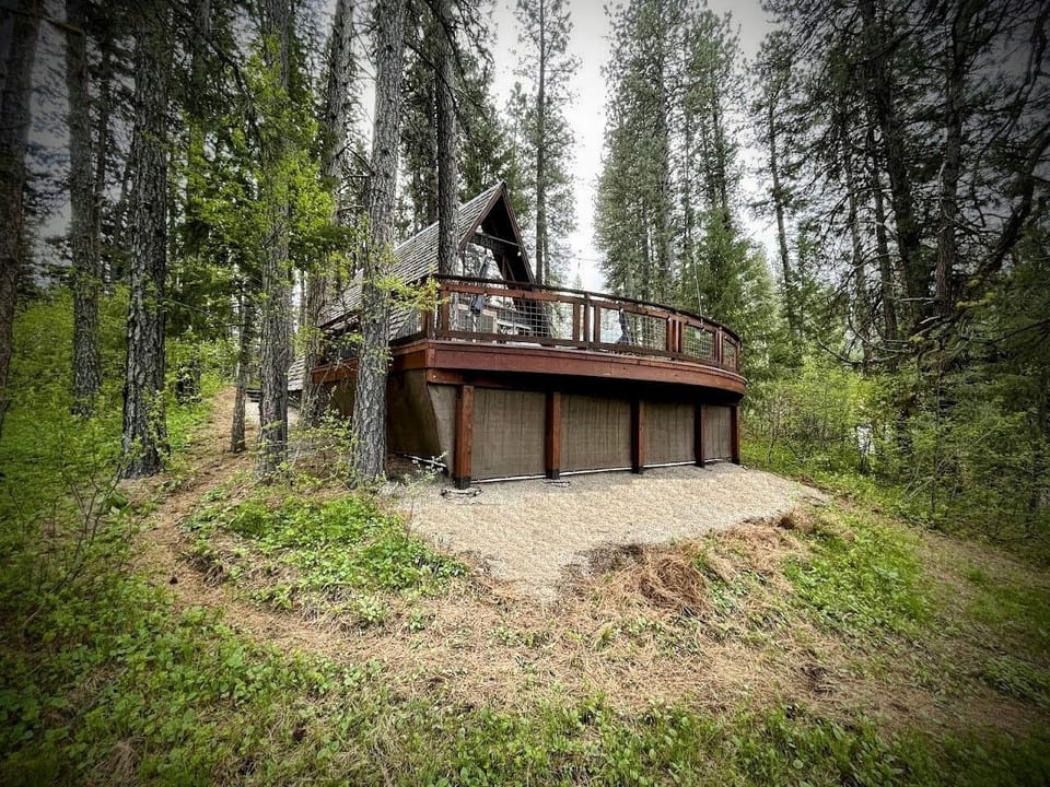 The deck is 7 feet above the ground and amongst the trees.