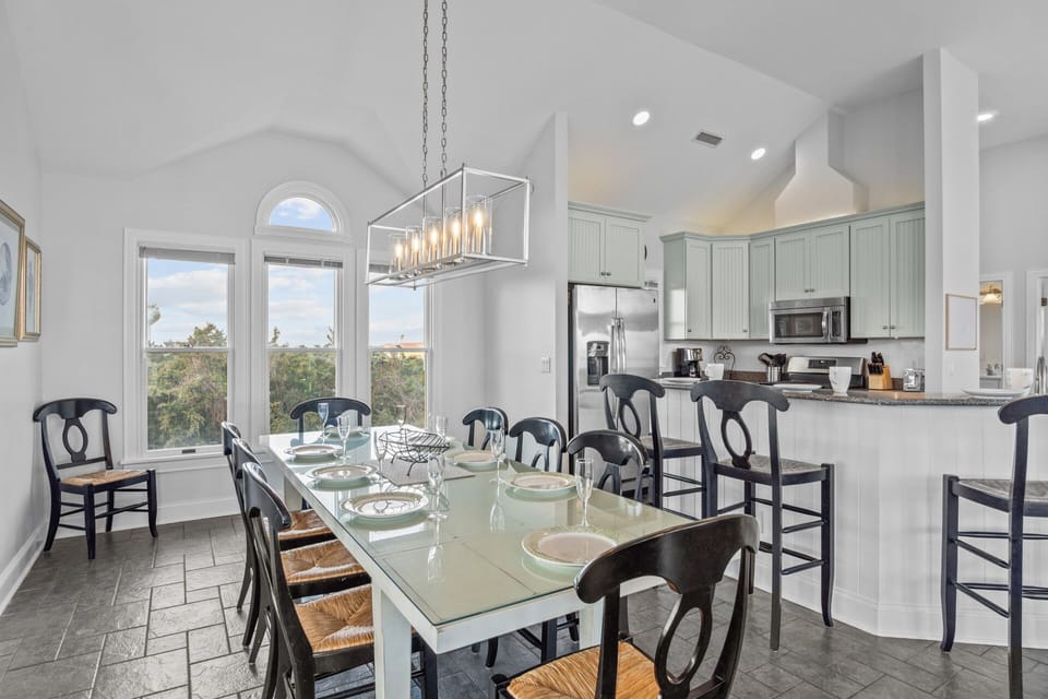 A 6-person breakfast bar is conveniently located next to the dining area, providing additional seating.