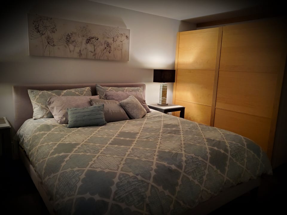 king size bedroom with lots of storage for 
 personal items