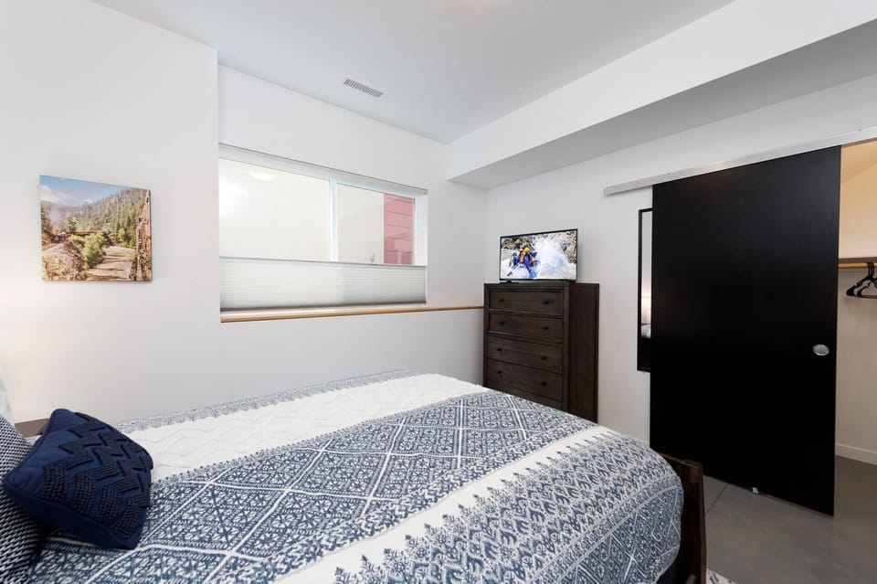 Durango, CO Vacation Rental Townhome - Bedroom with queen size bed, tv, clothes dresser, closet