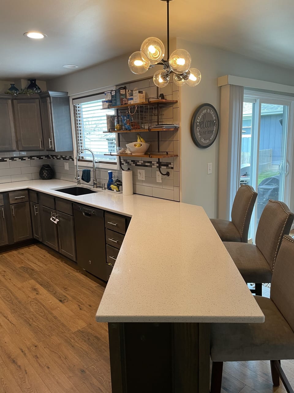 Kitchen leading  out to patio with grill and gazebo 