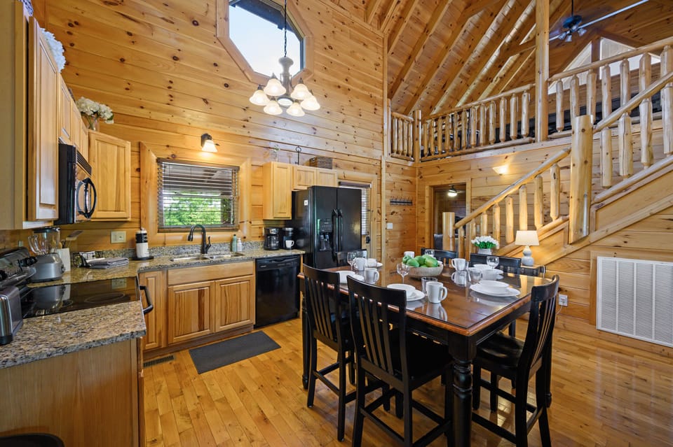 Open concept kitchen area, dining table for 6 and a fully stocked kitchen. 