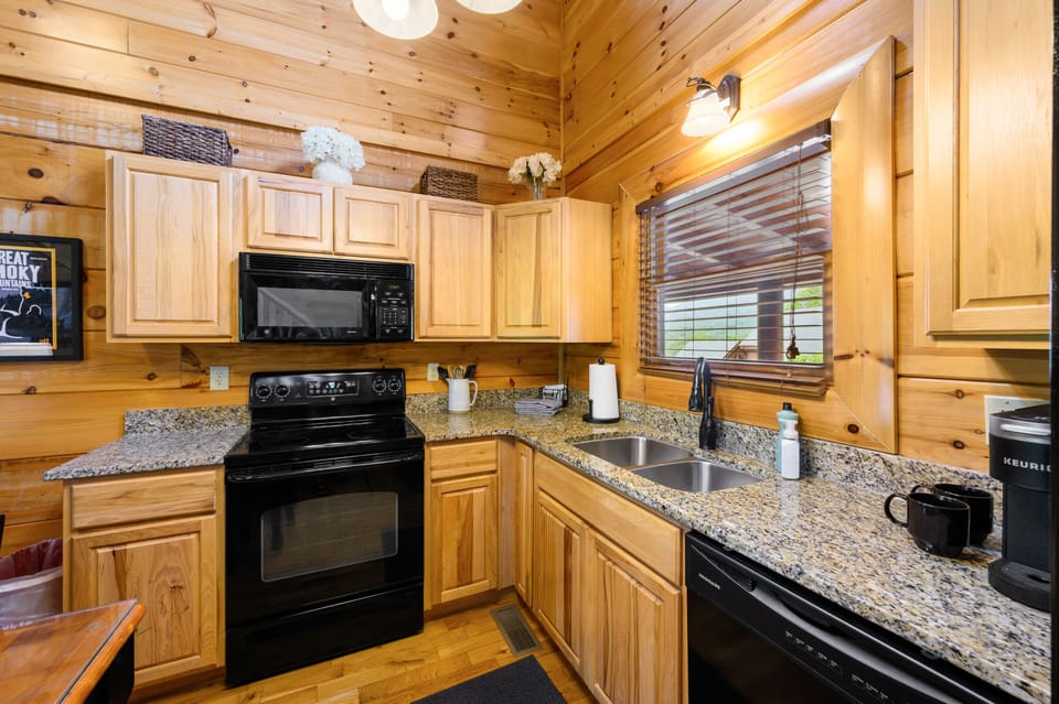 Open concept kitchen area, dining table for 6 and a fully stocked kitchen. 