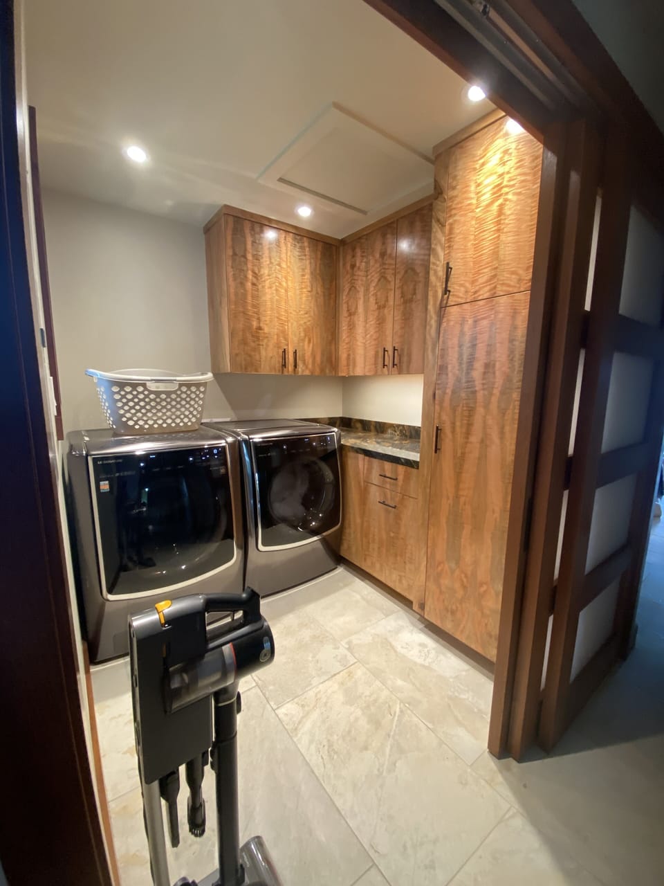 Laundry room, full washer/dryer, iron & ironing board, drying rack, vacuum.