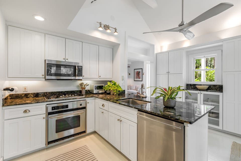 Spacious gourmet kitchen with generous storage space and bar seating