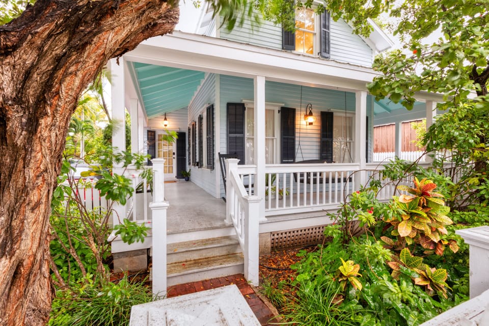 Lovely 1890's Key West Home with wrap-around porch and rooftop deck.  