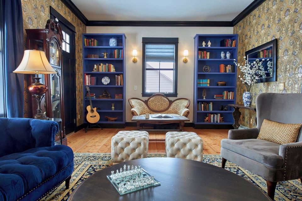 Upscale interior design throughout the house incorporates elements from the late 1800s with a bohemian flair, unique artwork, and modern-day conveniences.