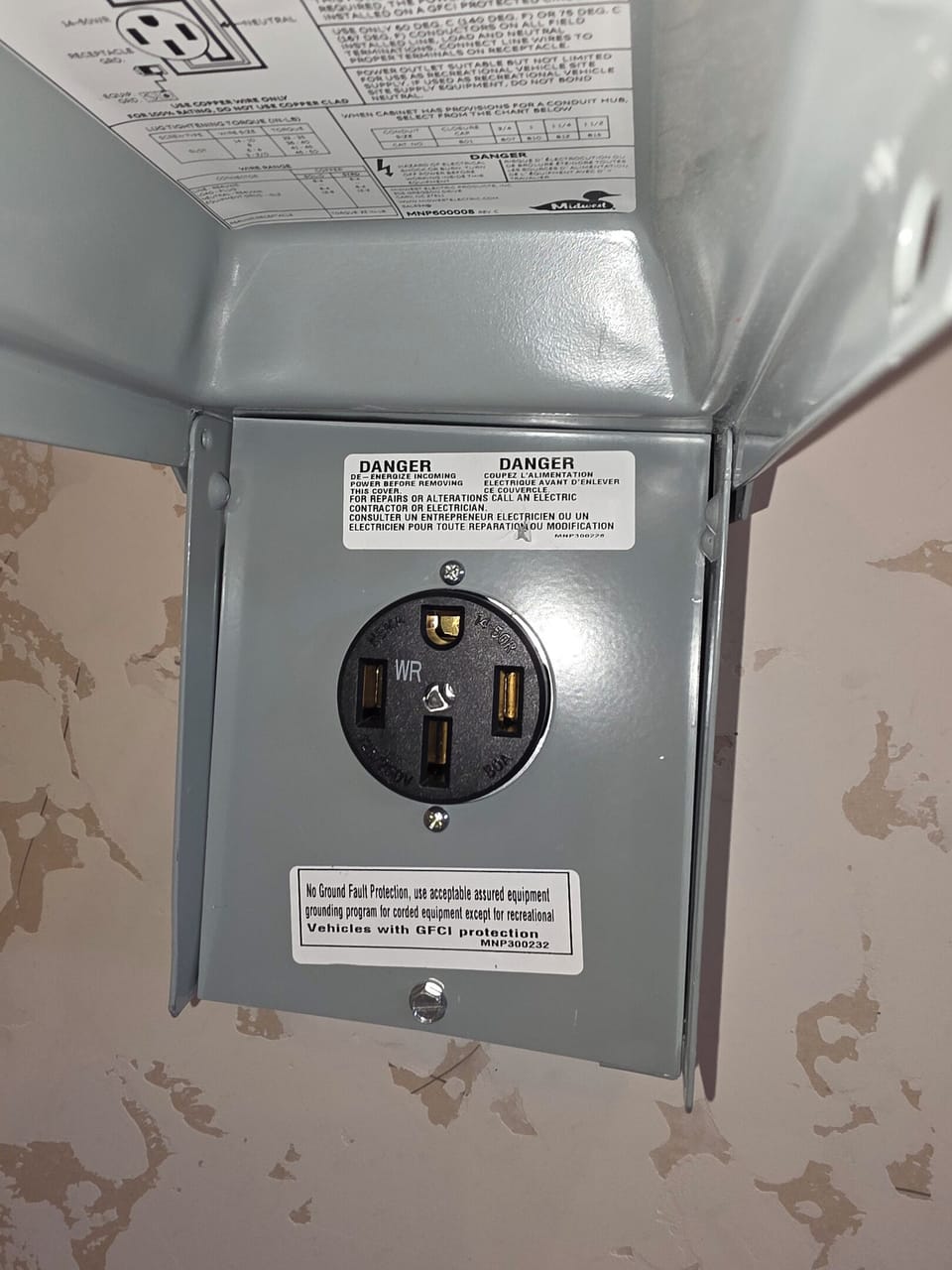 Electric vehicle charger in garage.
