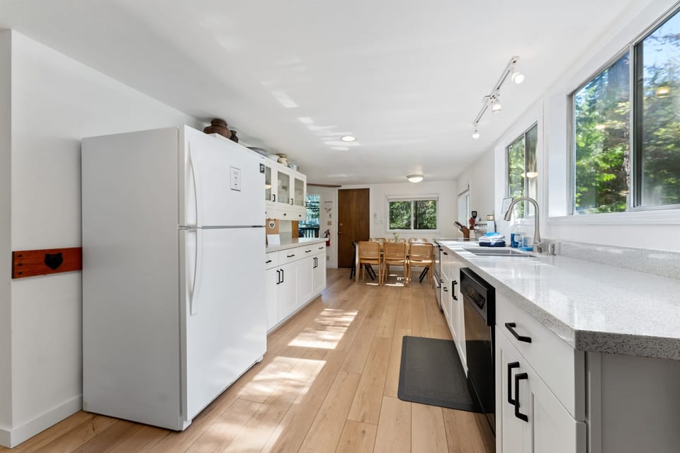 Newly updated and light filled eat-in kitchen, open to dining area. 