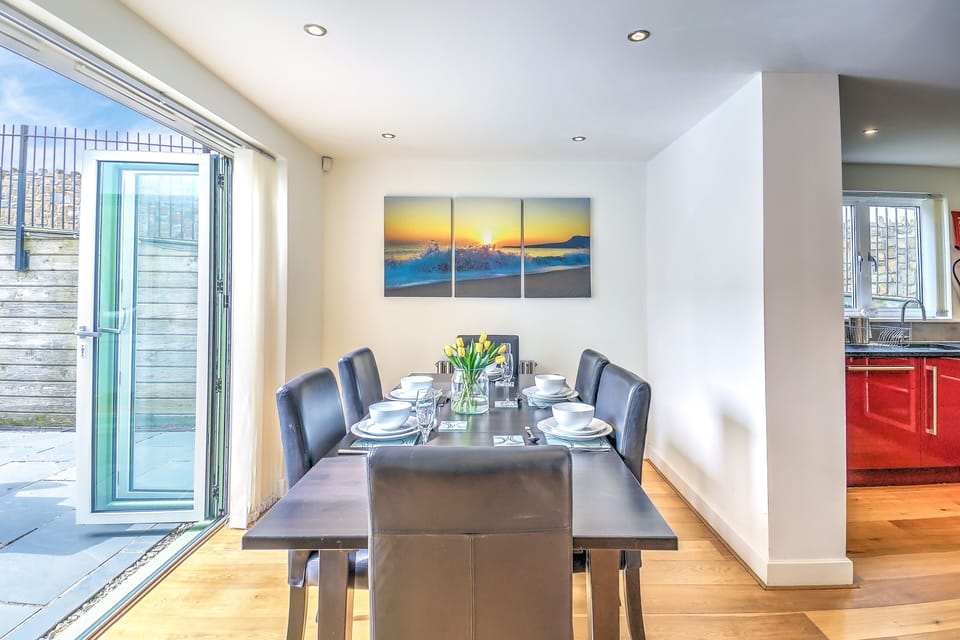 Dining area with bi-folding doors directly onto patio terrace