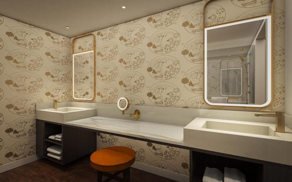 Get ready in style with double sinks and glowing vanity mirrors.