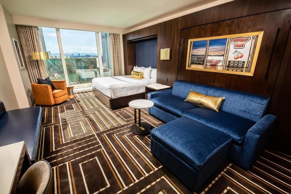 Unwind in a stylish room with skyline views and lounge seating.