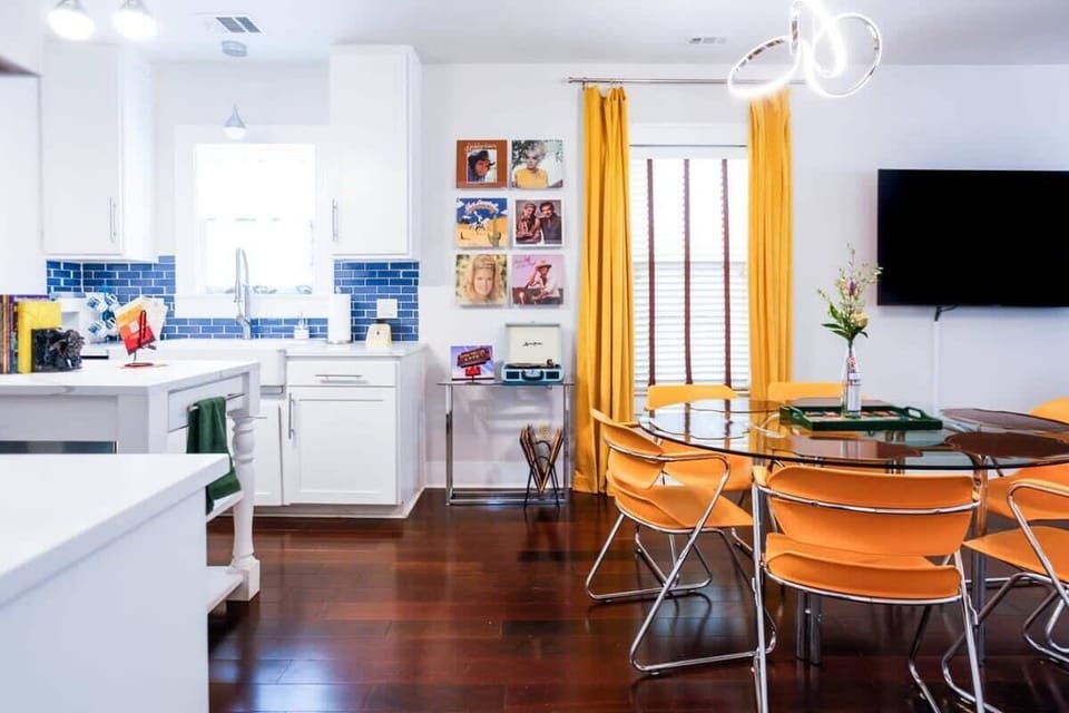 The dining room comfortably seats 6 with a nearby record player to amp up the ambiance.