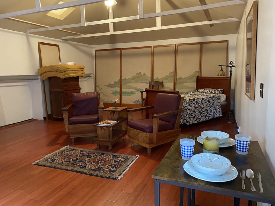 Dining, living, and bed area.