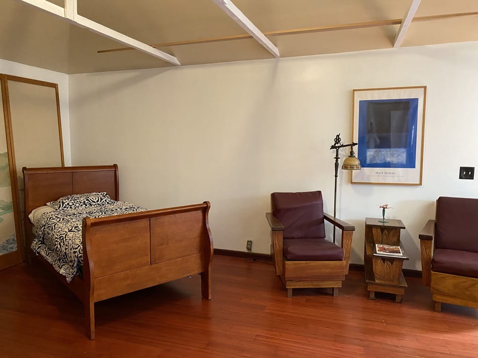 Single bed and sitting area.