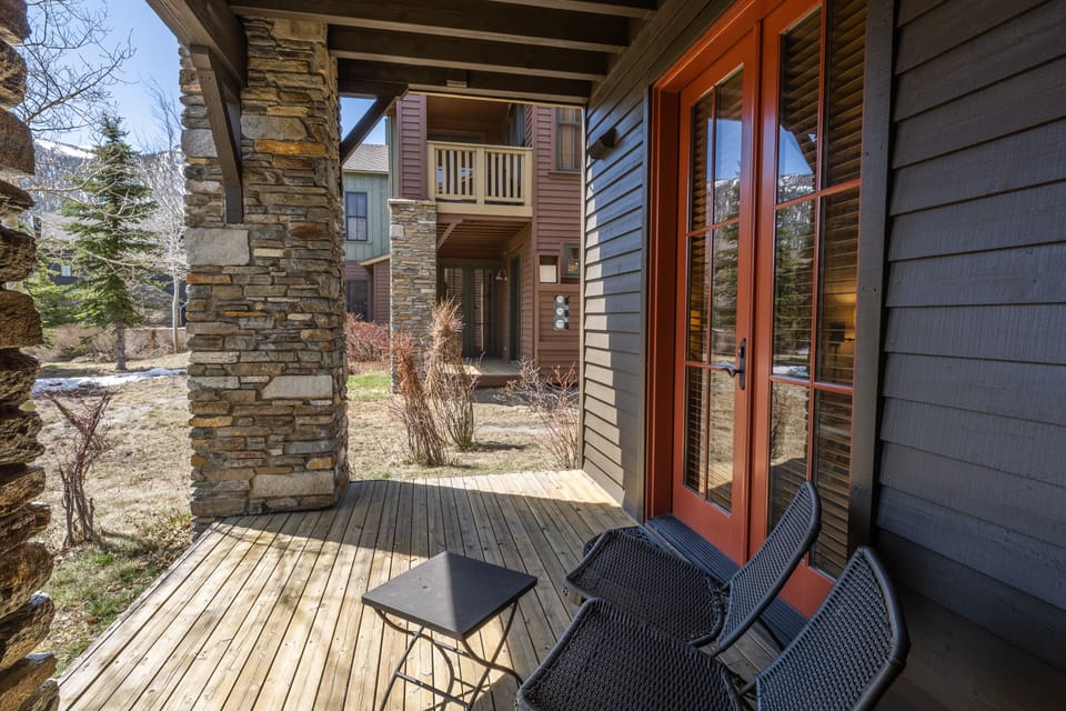 lower deck out to landscaped grounds and pond