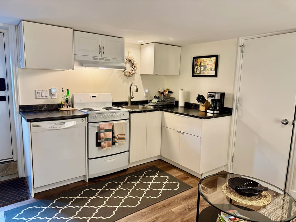 Full kitchen with dishwasher and oven