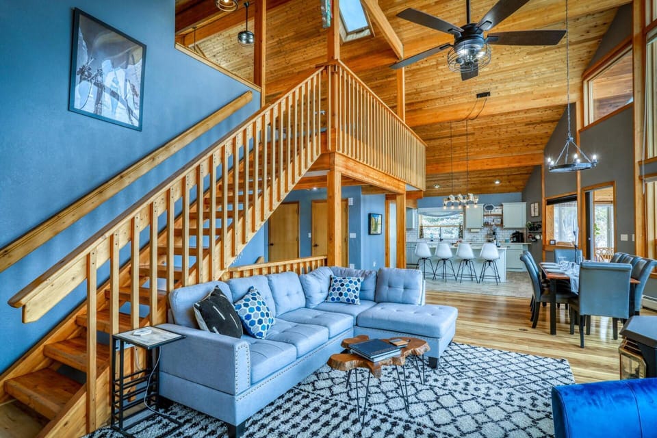 This open concept family room has it all, multiple seating areas,luxury kitchen, dining spaces, fireplace, and ohhh the views!