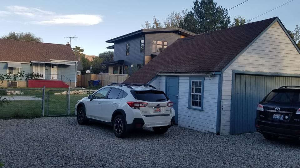 Designated parking in the back. Can fit three cars. Shed can be used for storage