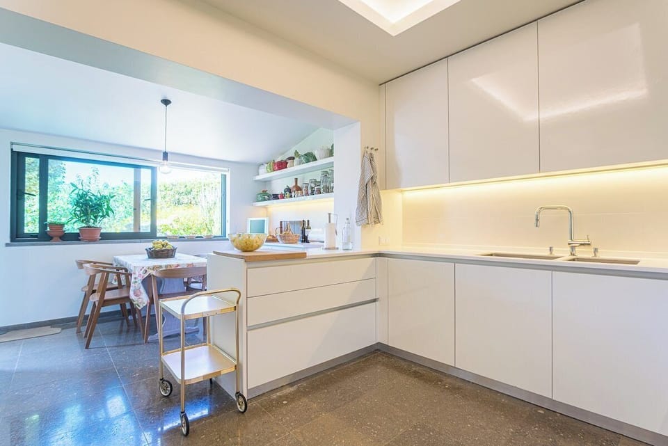 Modern kitchen with cream cabinetry and integrated lighting — Villa Santamaria, holiday villa in Sintra
