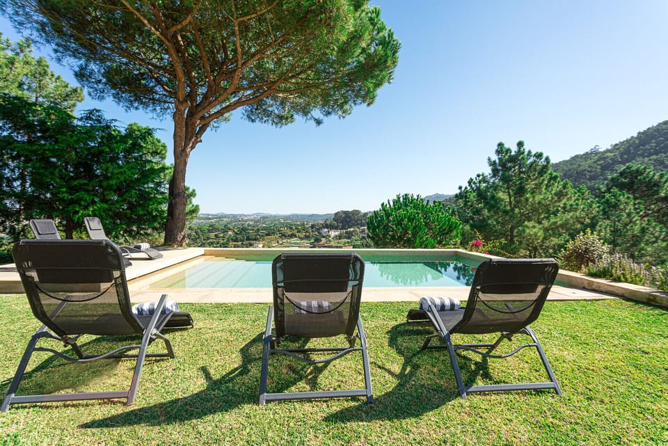 Pool area with loungers and hillside views — Villa Santamaria, luxury holiday villa in Sintra