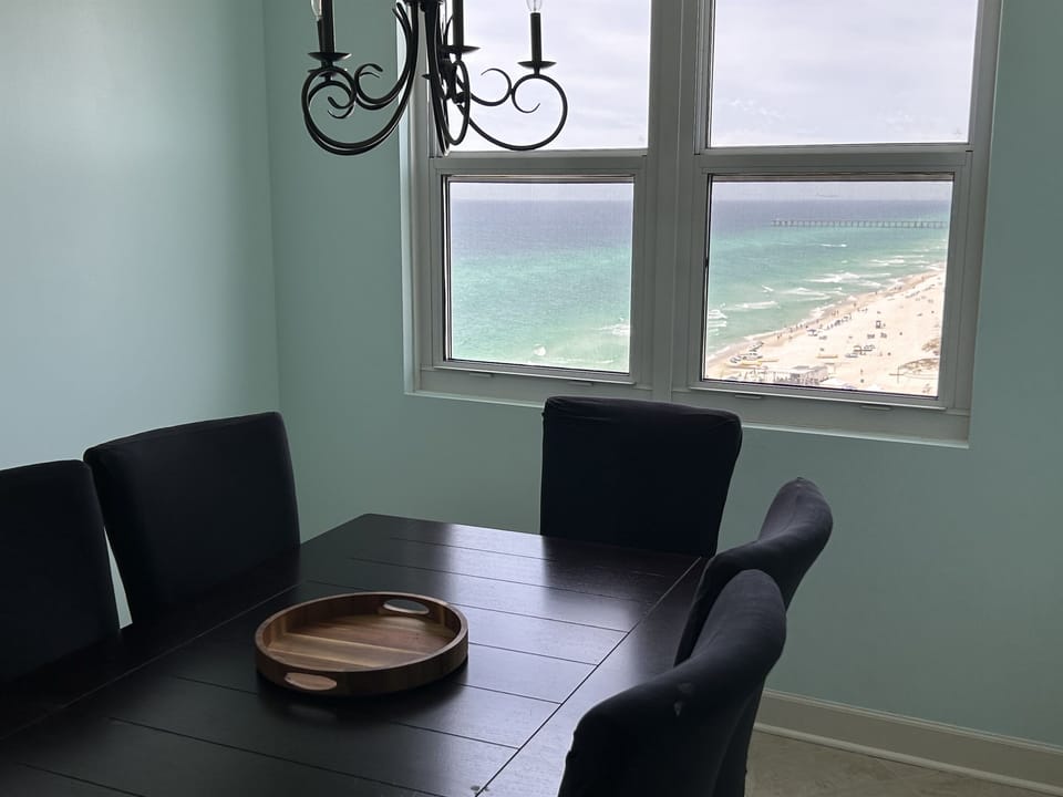 Savor morning coffee or evening meals at your dining table while gazing out at pristine turquoise waters and sandy shores stretching endlessly before you.