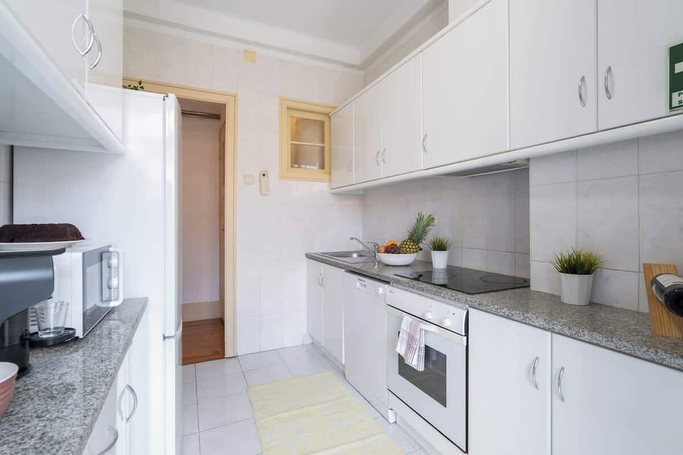 The kitchen is equipped with fridge, oven, stove, exhaust fume, microwave and utensils.