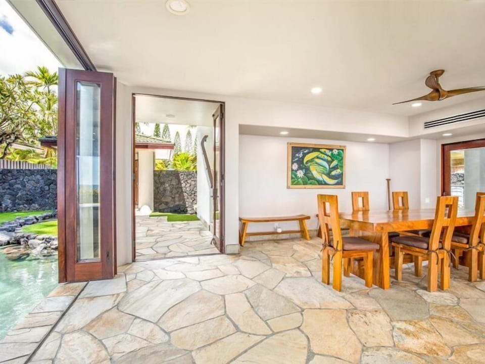 Large accordion doors open to embrace the pleasant ocean breezes.