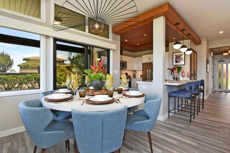 Indoor dining area seating six with ocean views and direct lanai access.