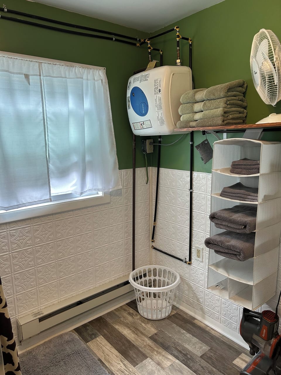 On demand water heater in bathroom.
