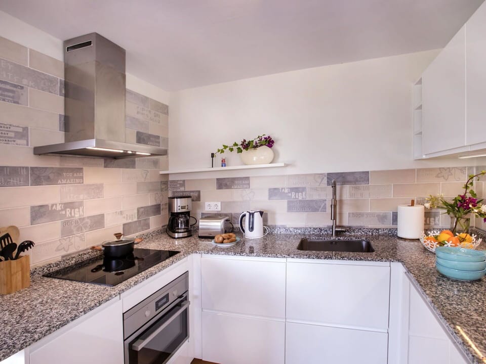 Countertop, Cabinetry, Kitchen, Sink, Kitchen Appliance, Kitchen Stove, Home Appliance, Building, Interior Design, Exhaust Hood